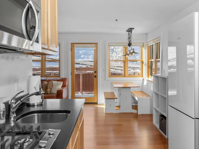 a bathroom with a sink vanity and toilet