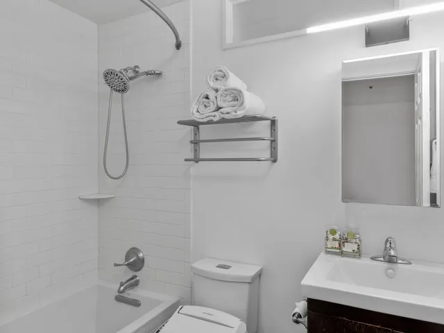 a picture of a bench in front of a wall