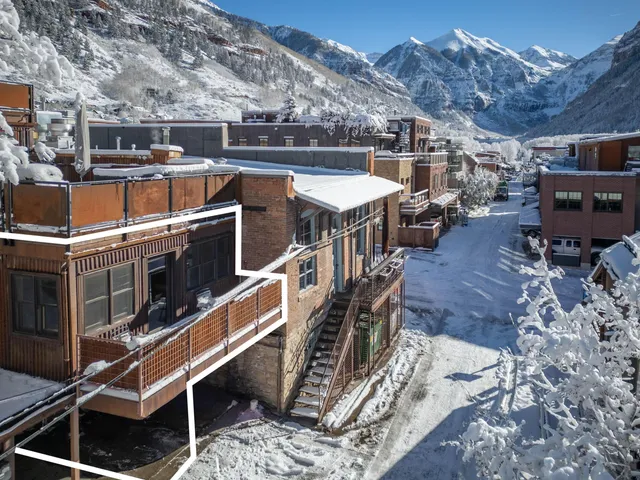 a terrace with a table and chairs