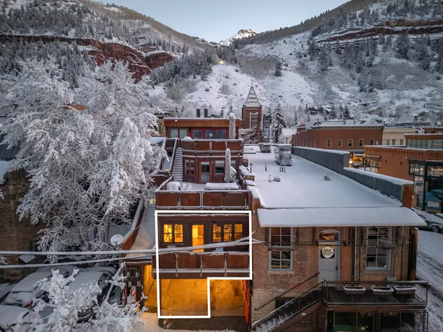 a front view of a house with parking space