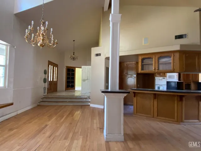 a kitchen with a stove top oven sink and cabinets