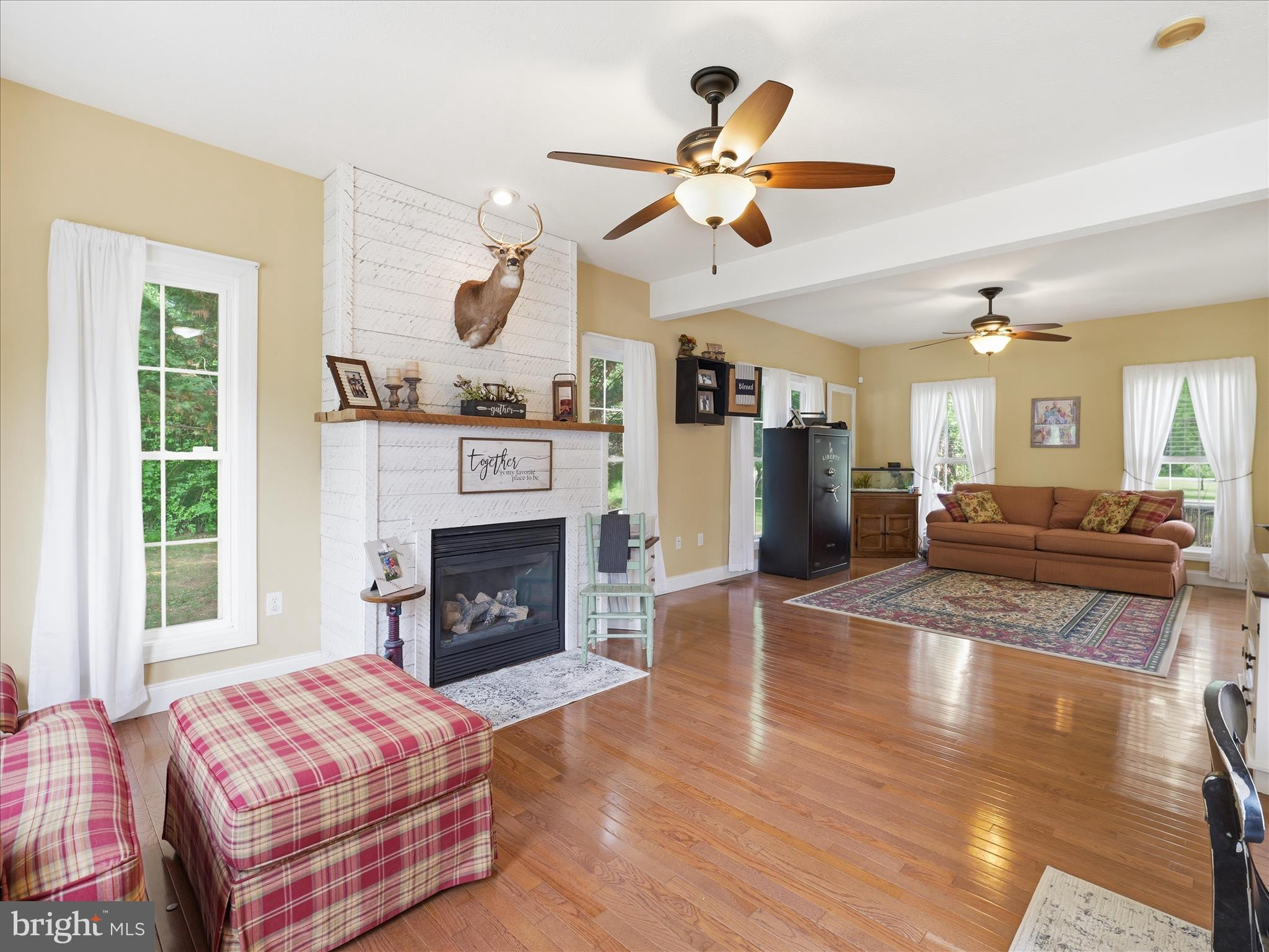 726 Doe Run Road Inwood, WV 25428 - Photo 32 of 68 a living room with furniture and a fireplace