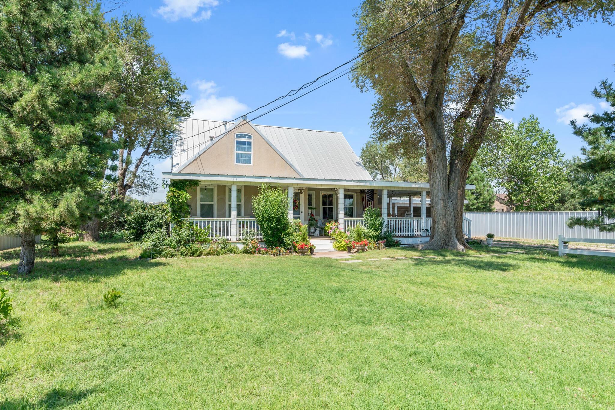 5211 River Road Amarillo, TX 79108 - Photo 2 of 39 a front view of a house with garden and porch