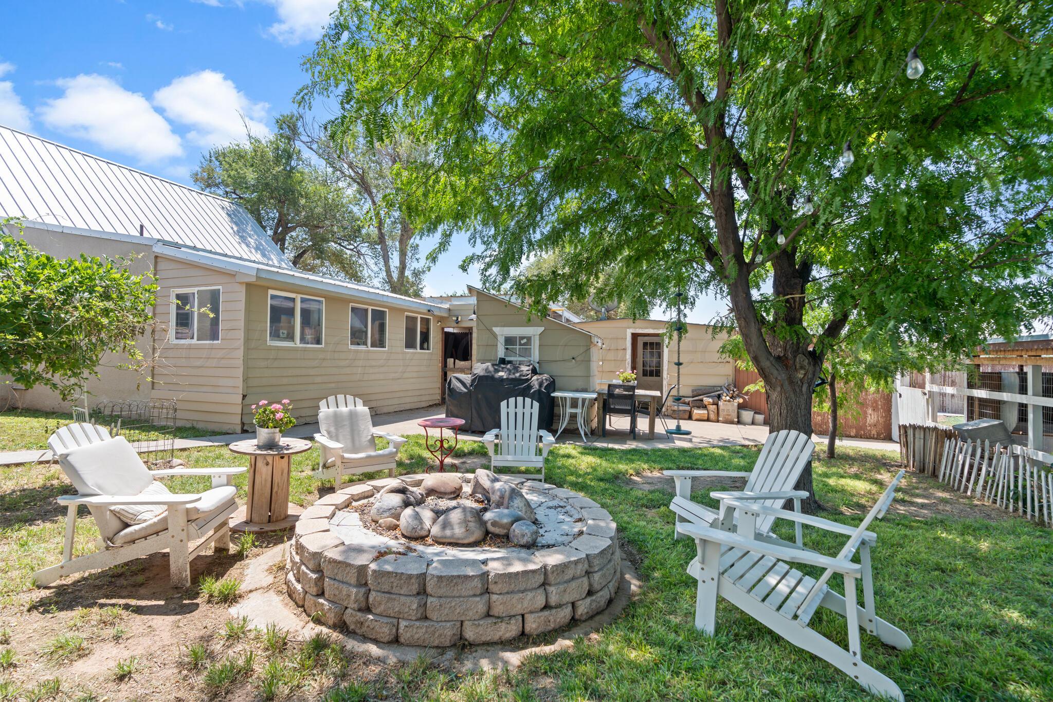 5211 River Road Amarillo, TX 79108 - Photo 32 of 39 a front view of a house with garden and chairs