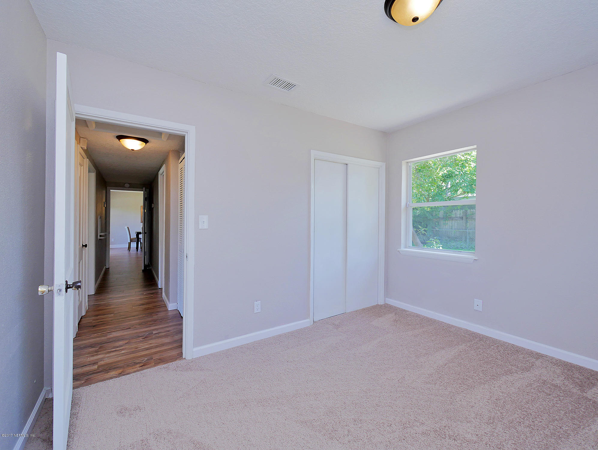 2448 Clemson Road Jacksonville, FL 32217 - Photo 16 of 21 wooden floor in a room
