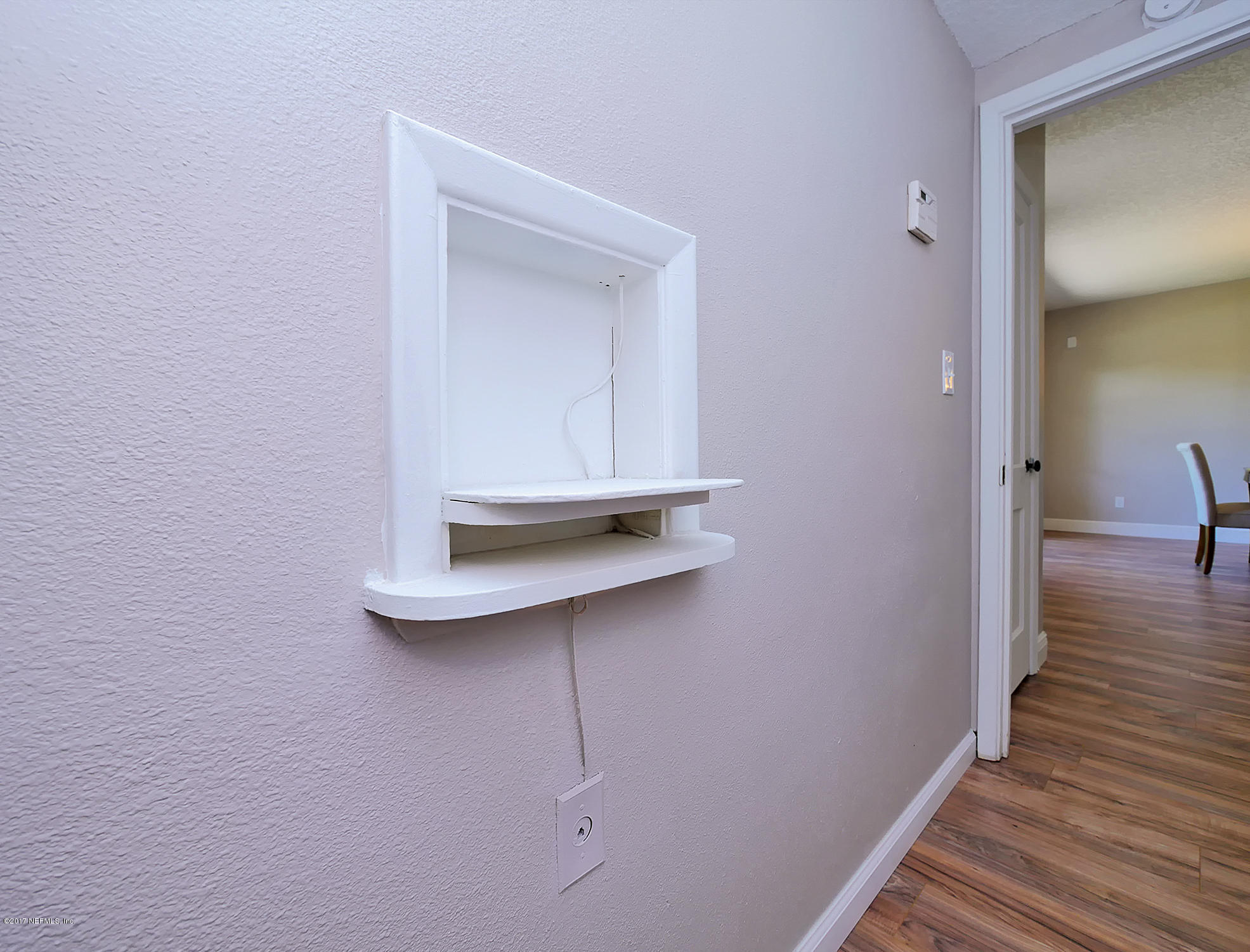 2448 Clemson Road Jacksonville, FL 32217 - Photo 17 of 21 a view of a room that has a bench in it