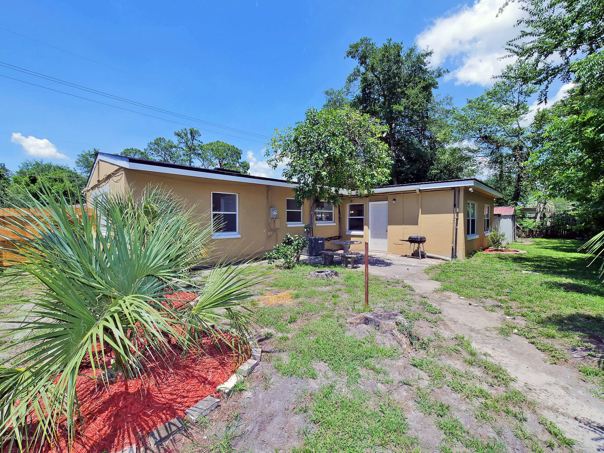 2448 Clemson Road Jacksonville, FL 32217 - Photo 18 of 21 a house with trees in front of it
