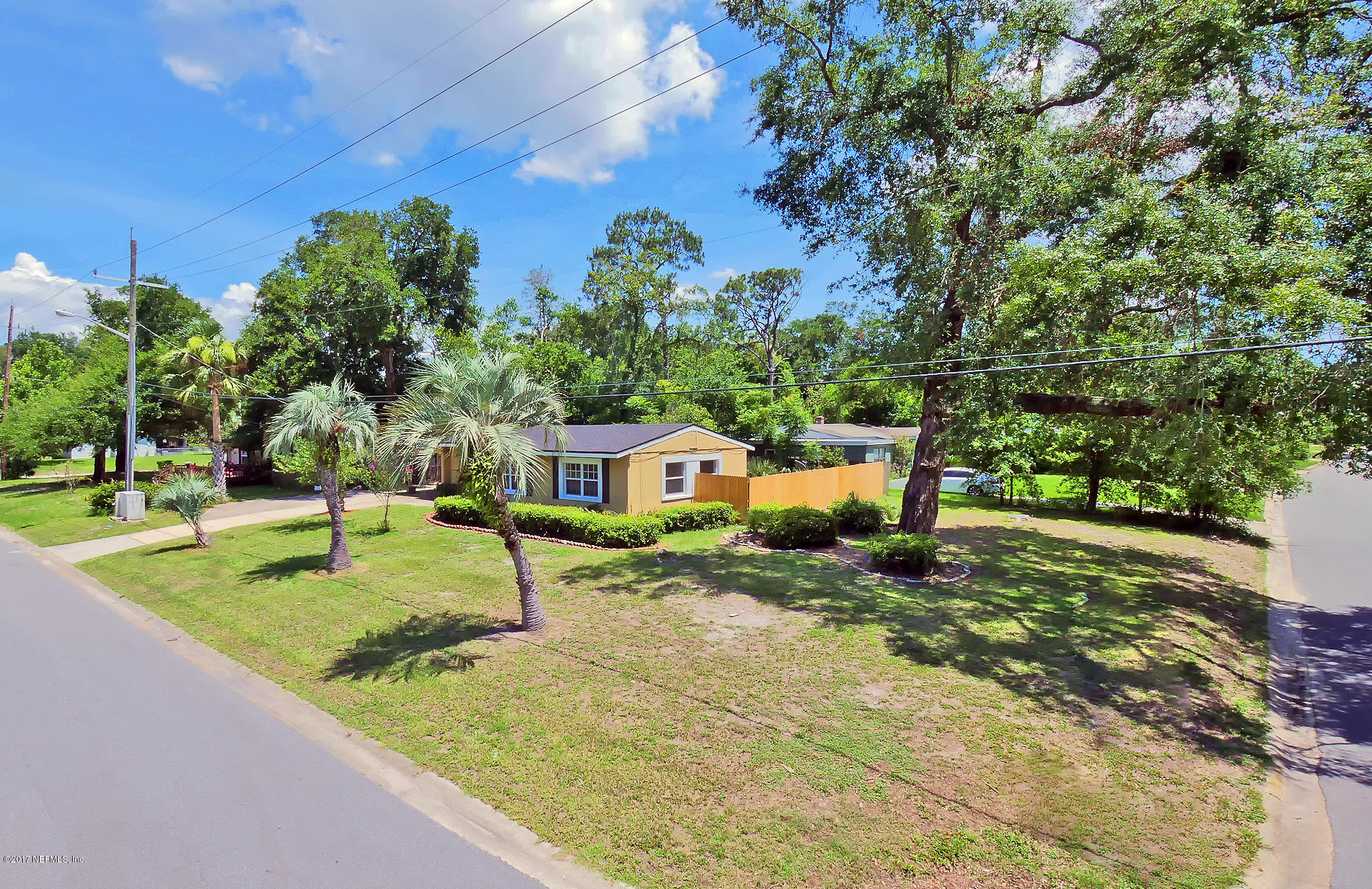 2448 Clemson Road Jacksonville, FL 32217 - Photo 3 of 21 a house with trees in the background