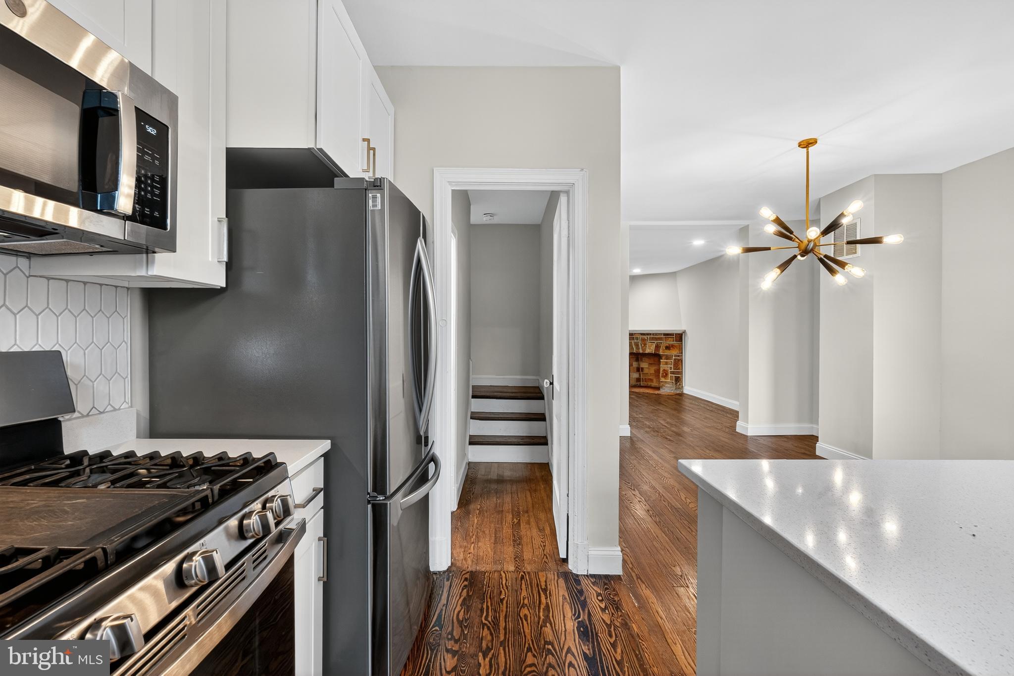 5221 2nd Street Northwest Washington, DC 20011 - Photo 12 of 39 a kitchen with stainless steel appliances granite countertop a stove and a refrigerator
