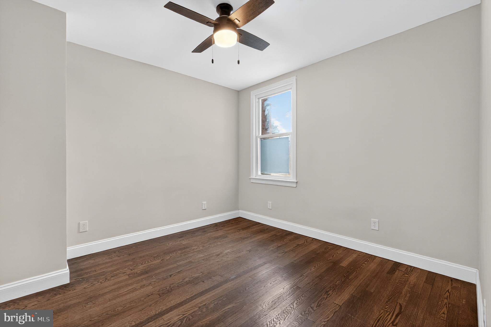 5221 2nd Street Northwest Washington, DC 20011 - Photo 15 of 39 wooden floor in an empty room with a window