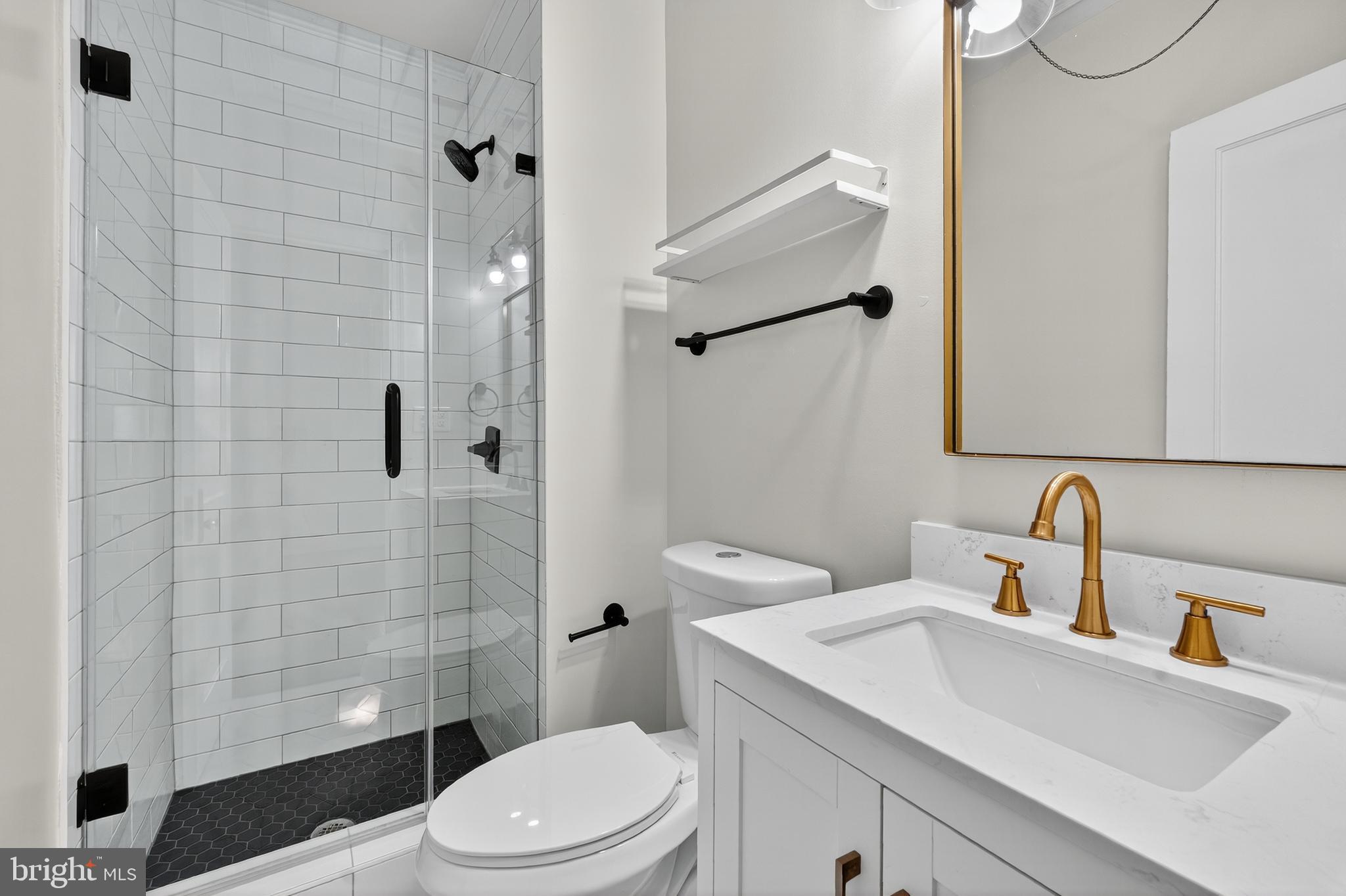 5221 2nd Street Northwest Washington, DC 20011 - Photo 22 of 39 a bathroom with a sink a toilet and shower