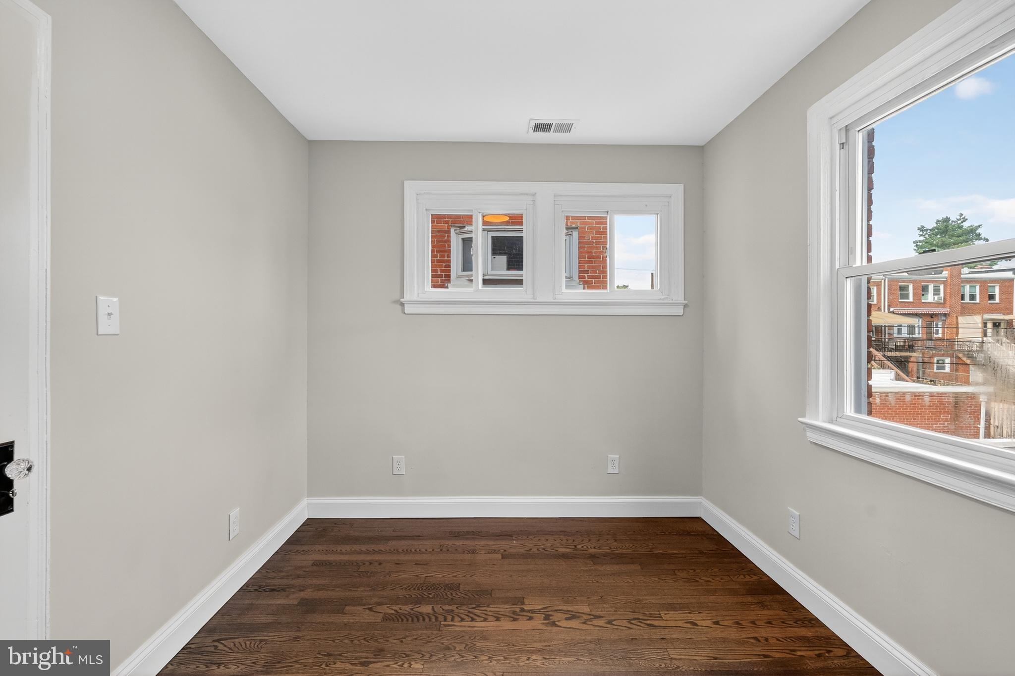 5221 2nd Street Northwest Washington, DC 20011 - Photo 25 of 39 wooden floor in an empty room with a window