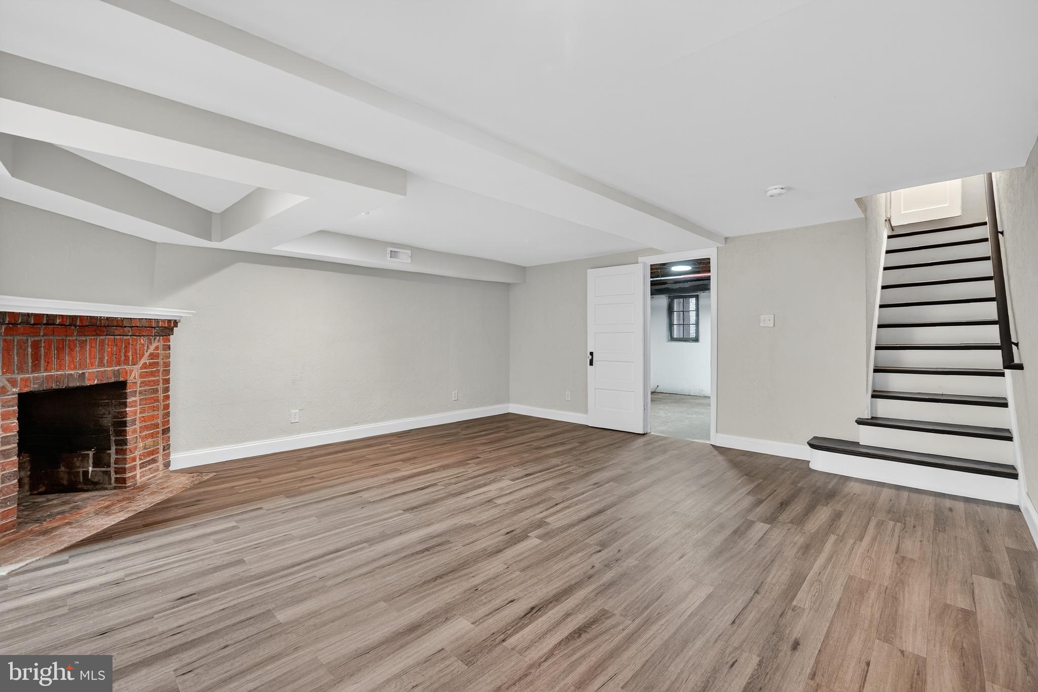 5221 2nd Street Northwest Washington, DC 20011 - Photo 27 of 39 a view of empty room with wooden floor and fireplace