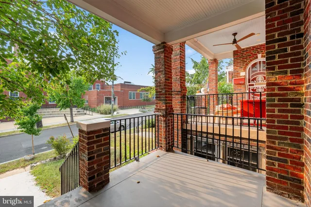 a view of balcony with wooden fence
