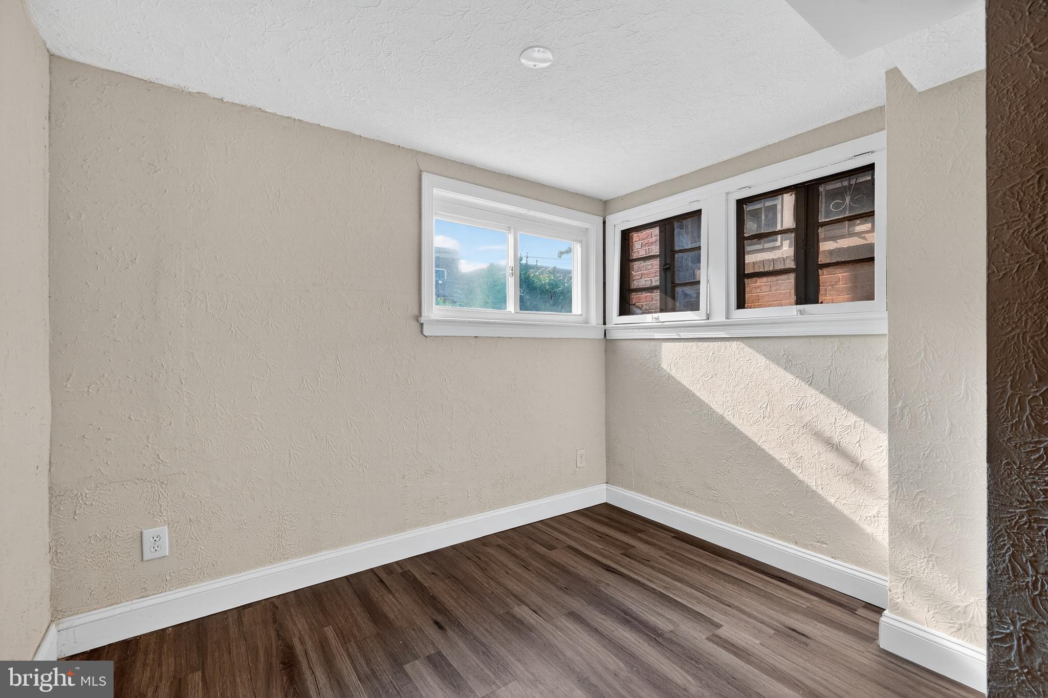 5221 2nd Street Northwest Washington, DC 20011 - Photo 29 of 39 a view of an empty room with wooden floor and a window