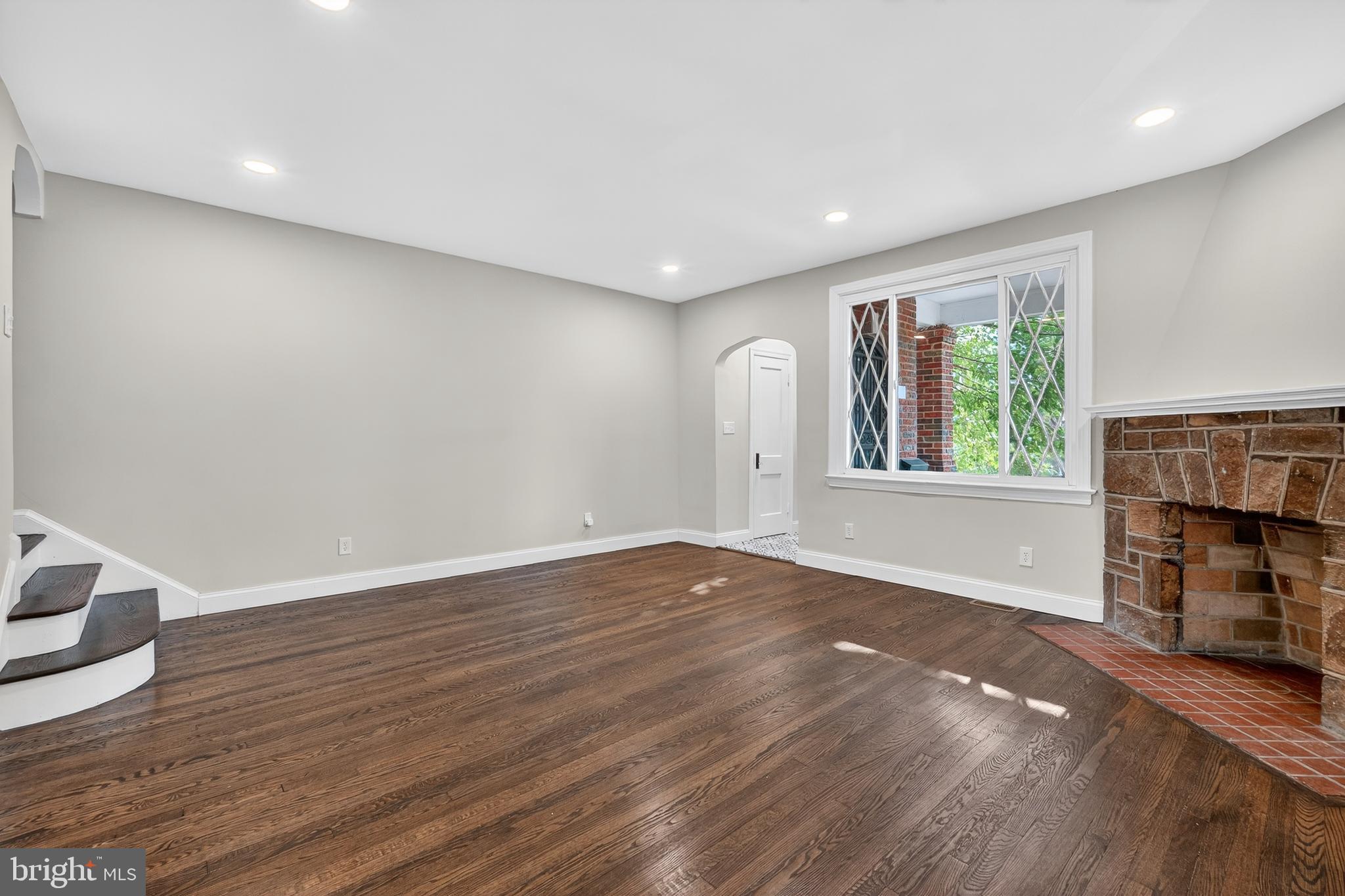 5221 2nd Street Northwest Washington, DC 20011 - Photo 7 of 39 a view of an empty room with wooden floor and a window
