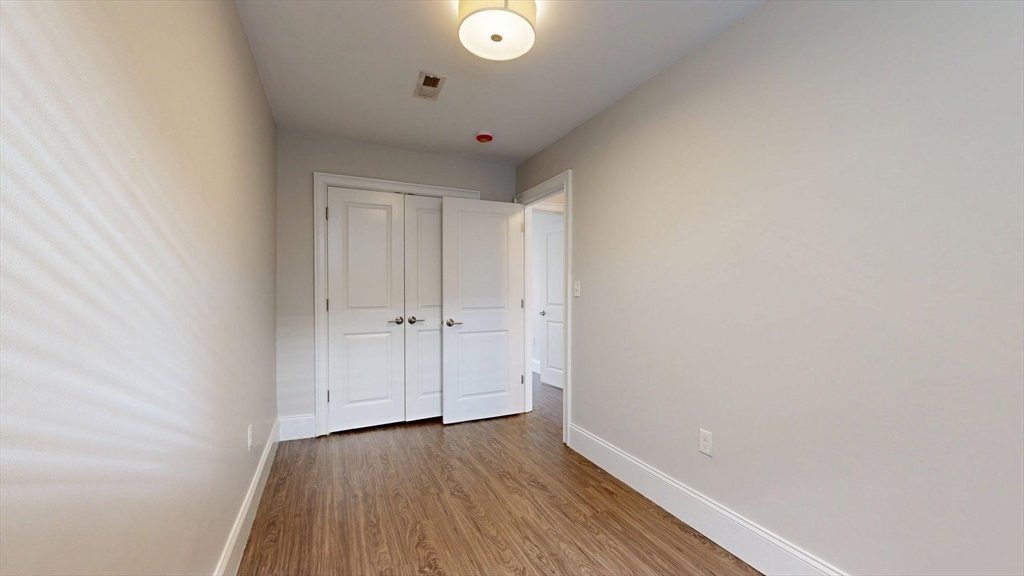 133 Paris Street, Unit 2 Boston, MA 02128 - Photo 12 of 26 a view of a hallway