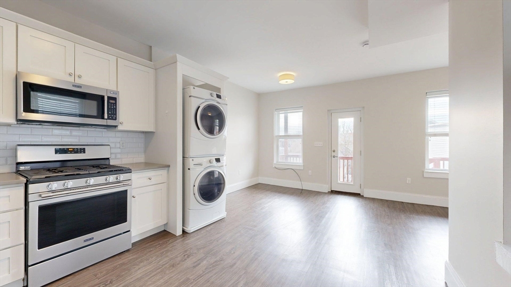133 Paris Street, Unit 2 Boston, MA 02128 - Photo 15 of 26 a view of kitchen with stove and microwave