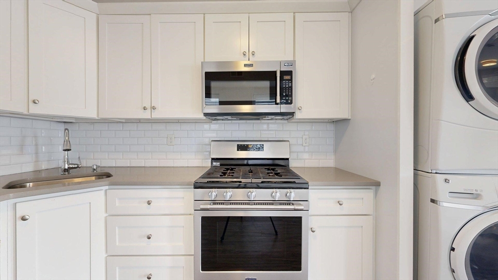 133 Paris Street, Unit 2 Boston, MA 02128 - Photo 17 of 26 a kitchen with a stove and a sink