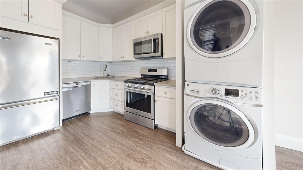 133 Paris Street, Unit 2 Boston, MA 02128 - Photo 23 of 26 a kitchen with a washer and dryer