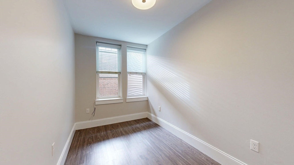 133 Paris Street, Unit 2 Boston, MA 02128 - Photo 8 of 26 a view of room with window and hardwood floor