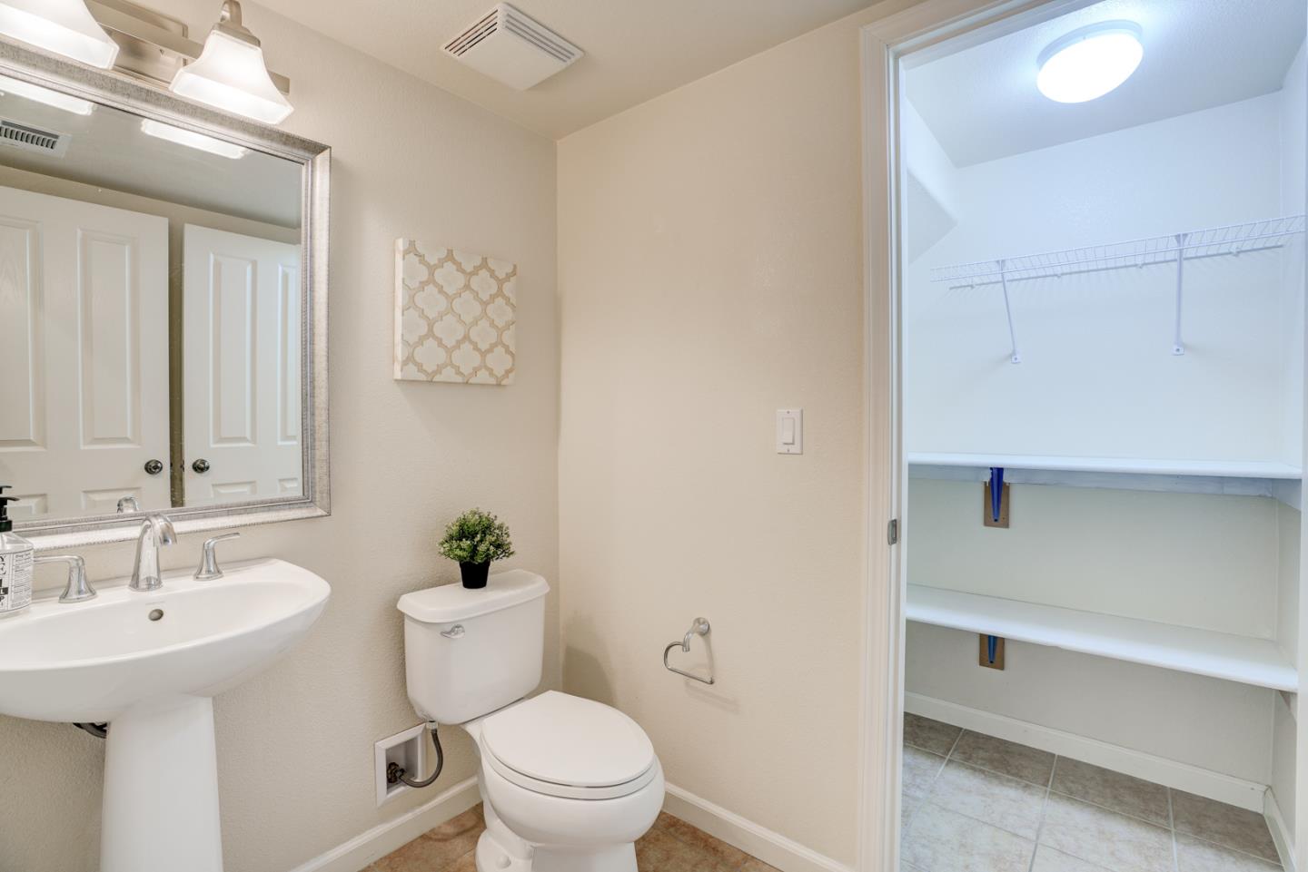 5300 Fioli Loop San Ramon, CA 94582 - Photo 13 of 38 a bathroom with a sink a toilet and a mirror