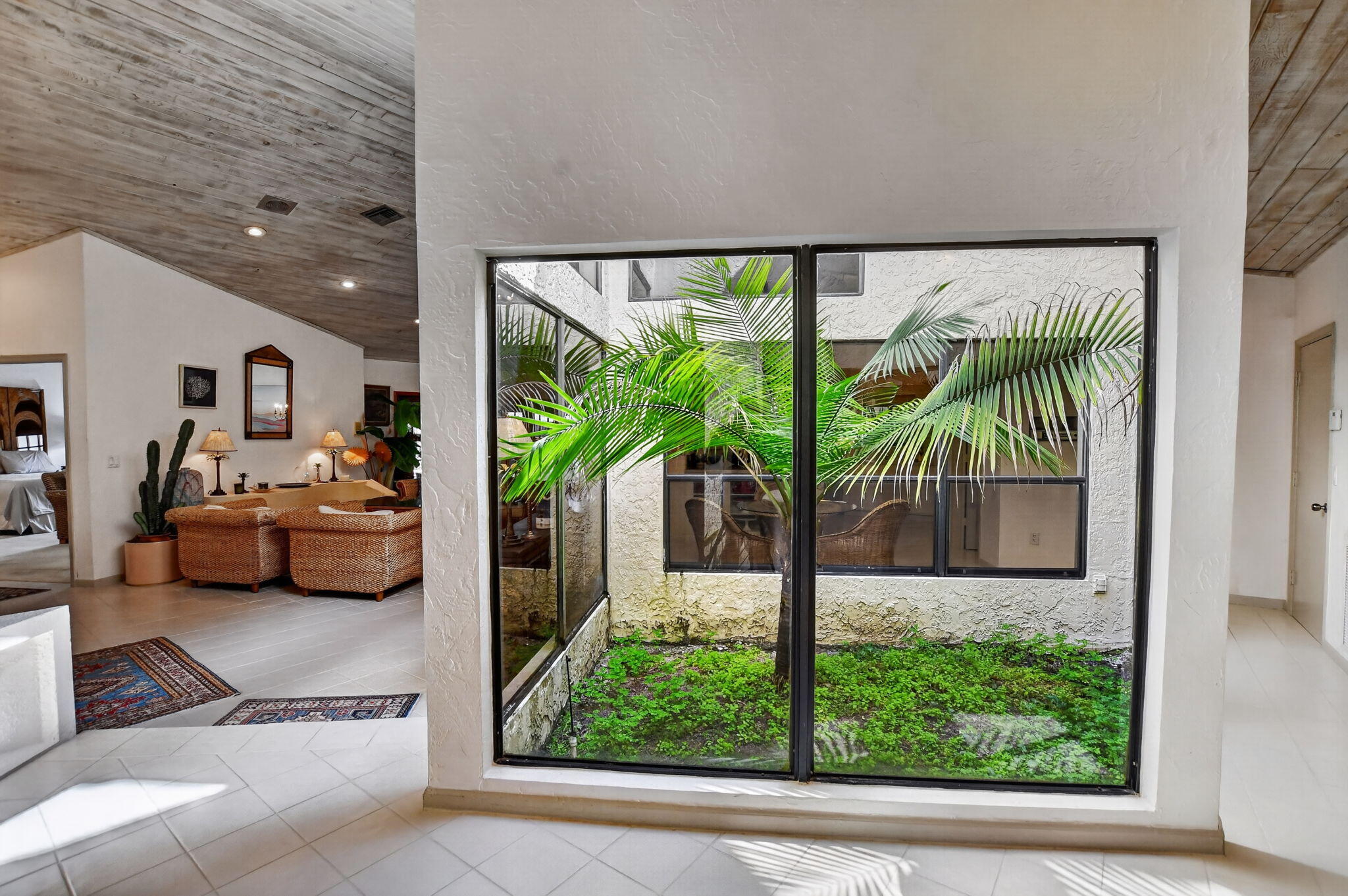22519 Esplanada Circle, Unit W Boca Raton, FL 33433 - Photo 6 of 57 a living room with furniture and a floor to ceiling window