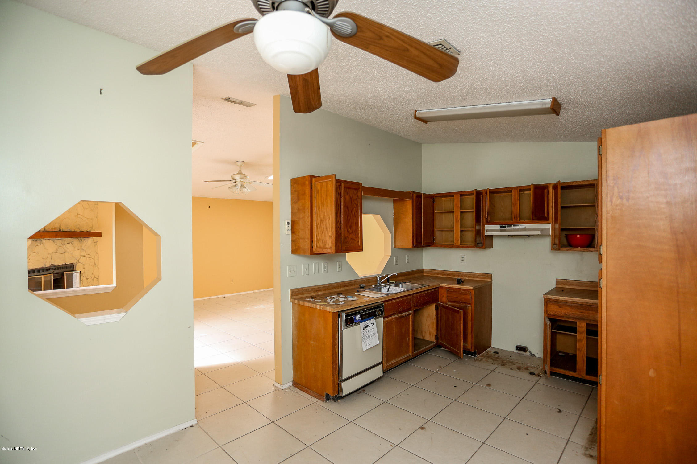 3165 Kings Road St. Augustine, FL 32086 - Photo 3 of 15 a kitchen with stainless steel appliances granite countertop a sink and cabinets