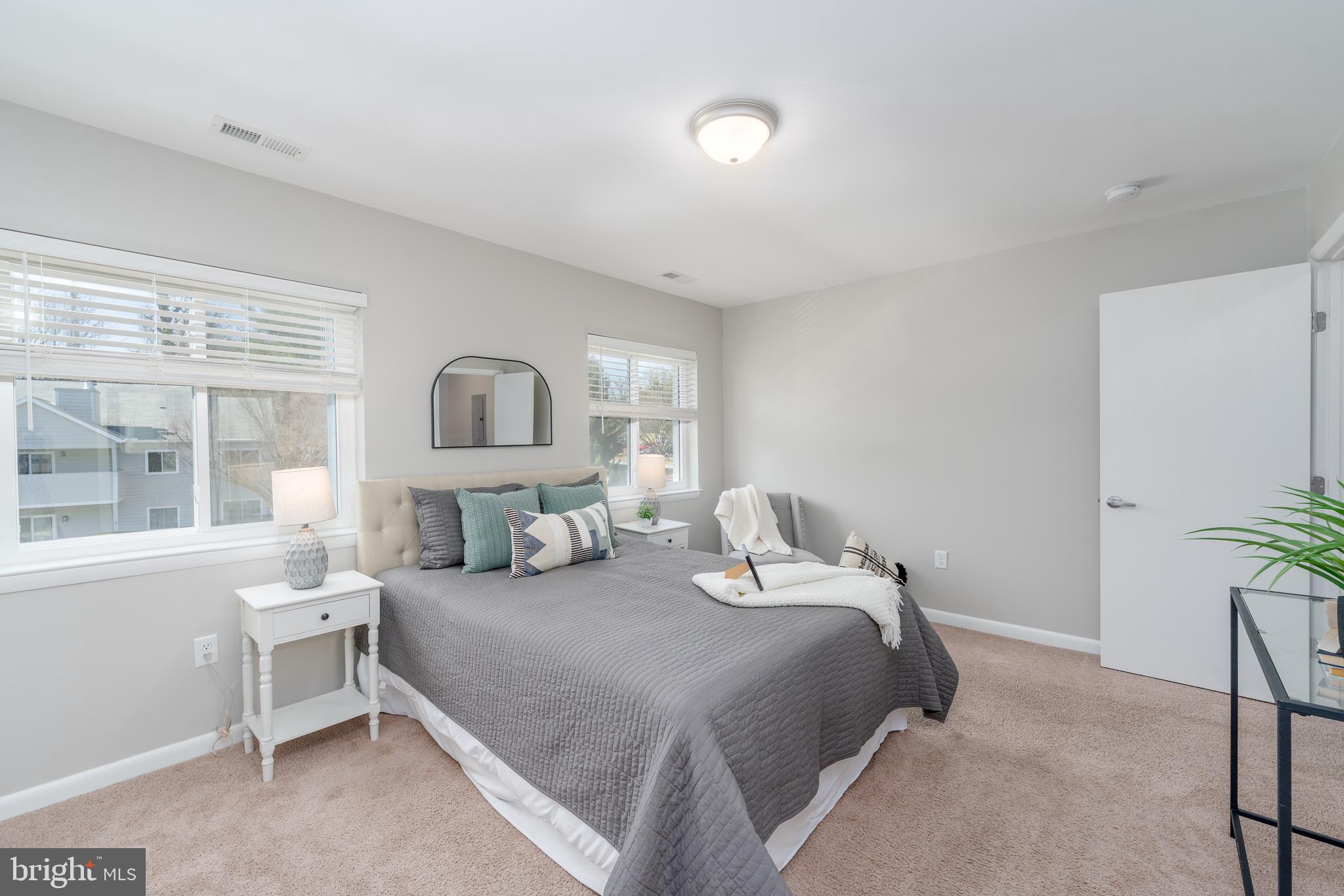 2213 Lowells Glen Road, Unit L Baltimore, MD 21234 - Photo 14 of 26 a bedroom with two beds and a large window