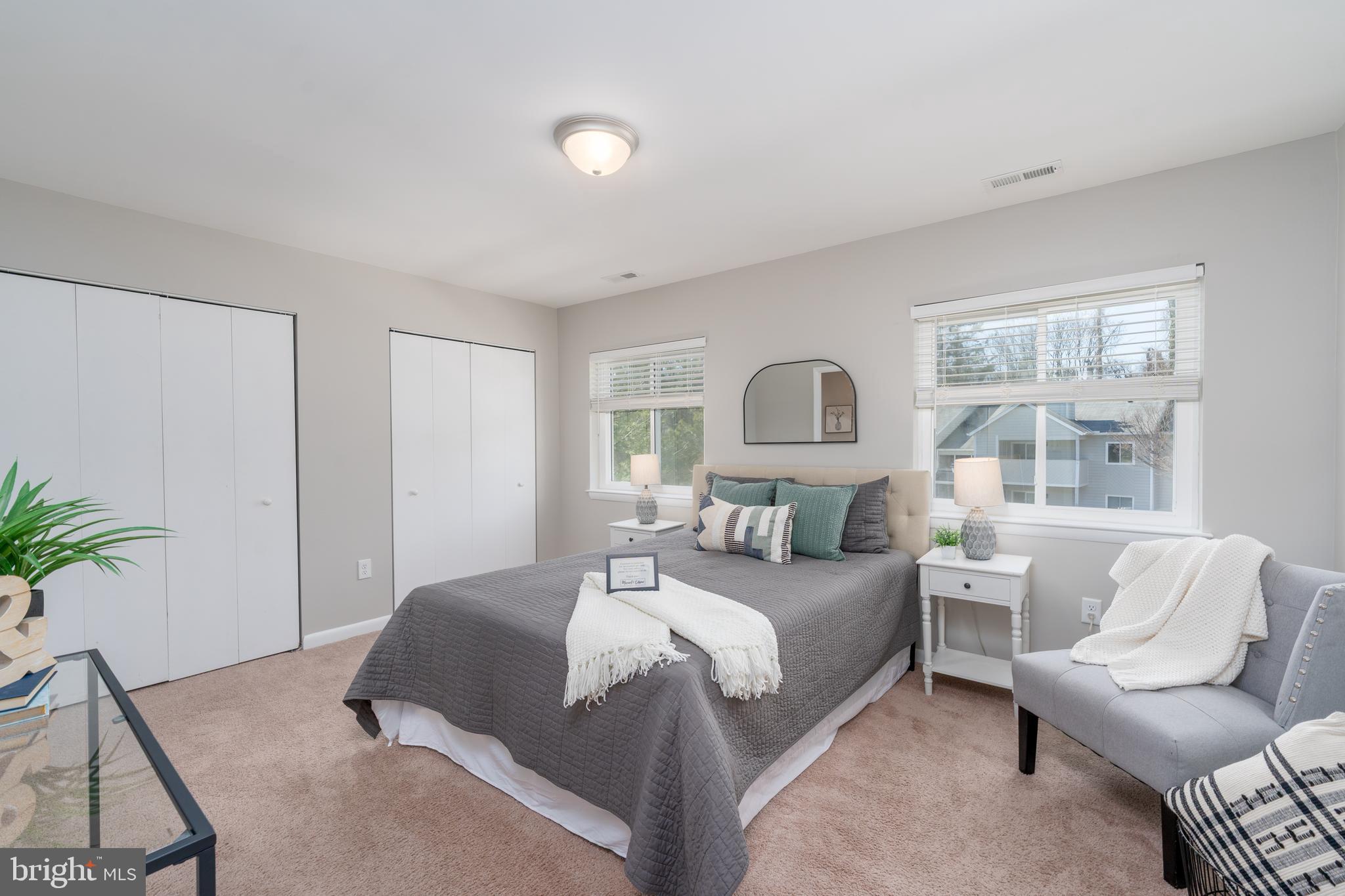 2213 Lowells Glen Road, Unit L Baltimore, MD 21234 - Photo 15 of 26 a bedroom with a large bed and a couch