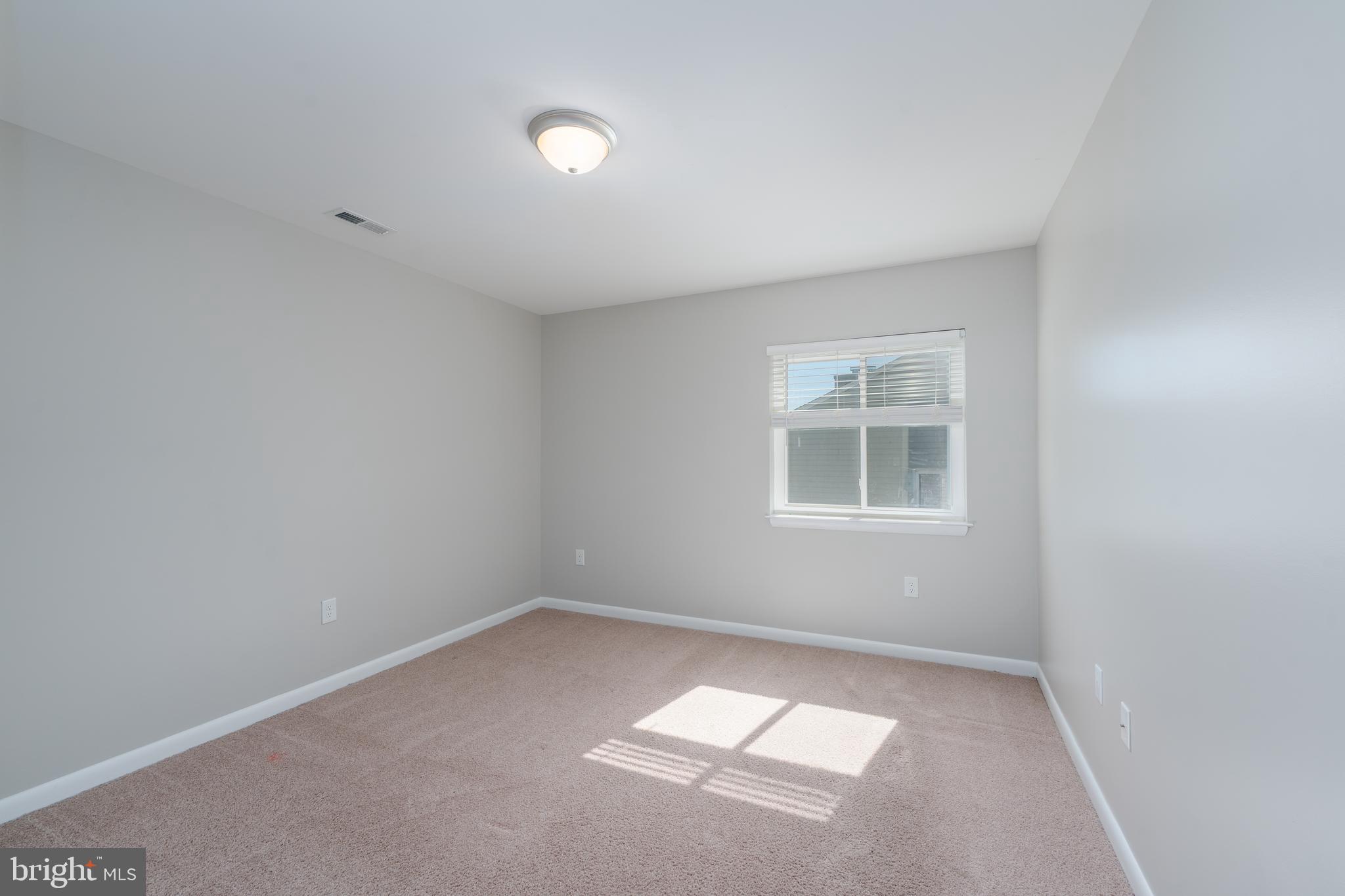 2213 Lowells Glen Road, Unit L Baltimore, MD 21234 - Photo 18 of 26 an empty room with a window