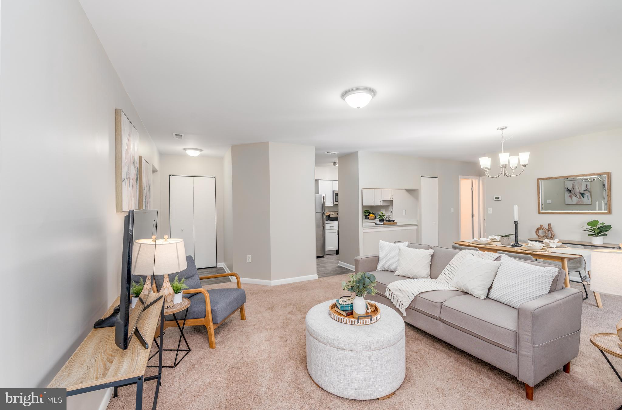 2213 Lowells Glen Road, Unit L Baltimore, MD 21234 - Photo 2 of 26 a living room with furniture and a wooden floor