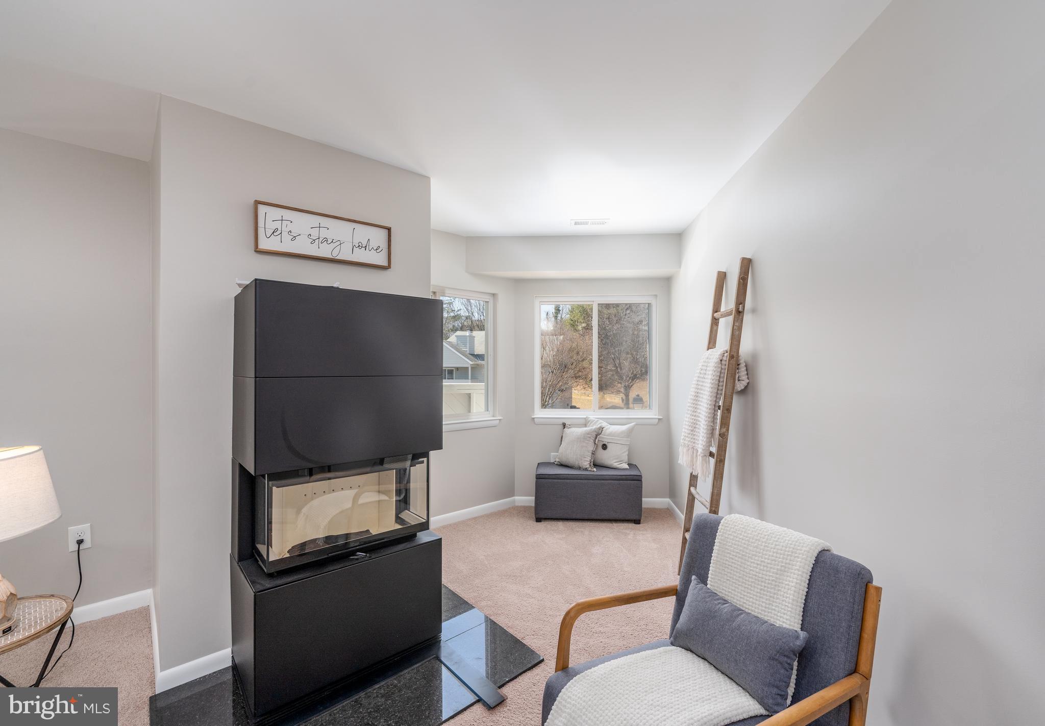 2213 Lowells Glen Road, Unit L Baltimore, MD 21234 - Photo 6 of 26 a living room with furniture and a flat screen tv