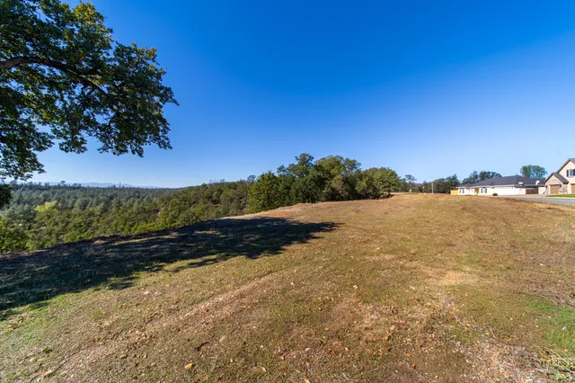 a view of a large body of water with a building in the background
