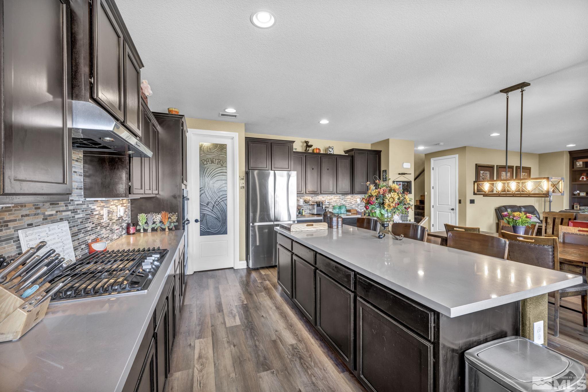 1610 Elk Run Trail Reno, NV 89523 - Photo 13 of 33 a kitchen with a stove a refrigerator and a sink