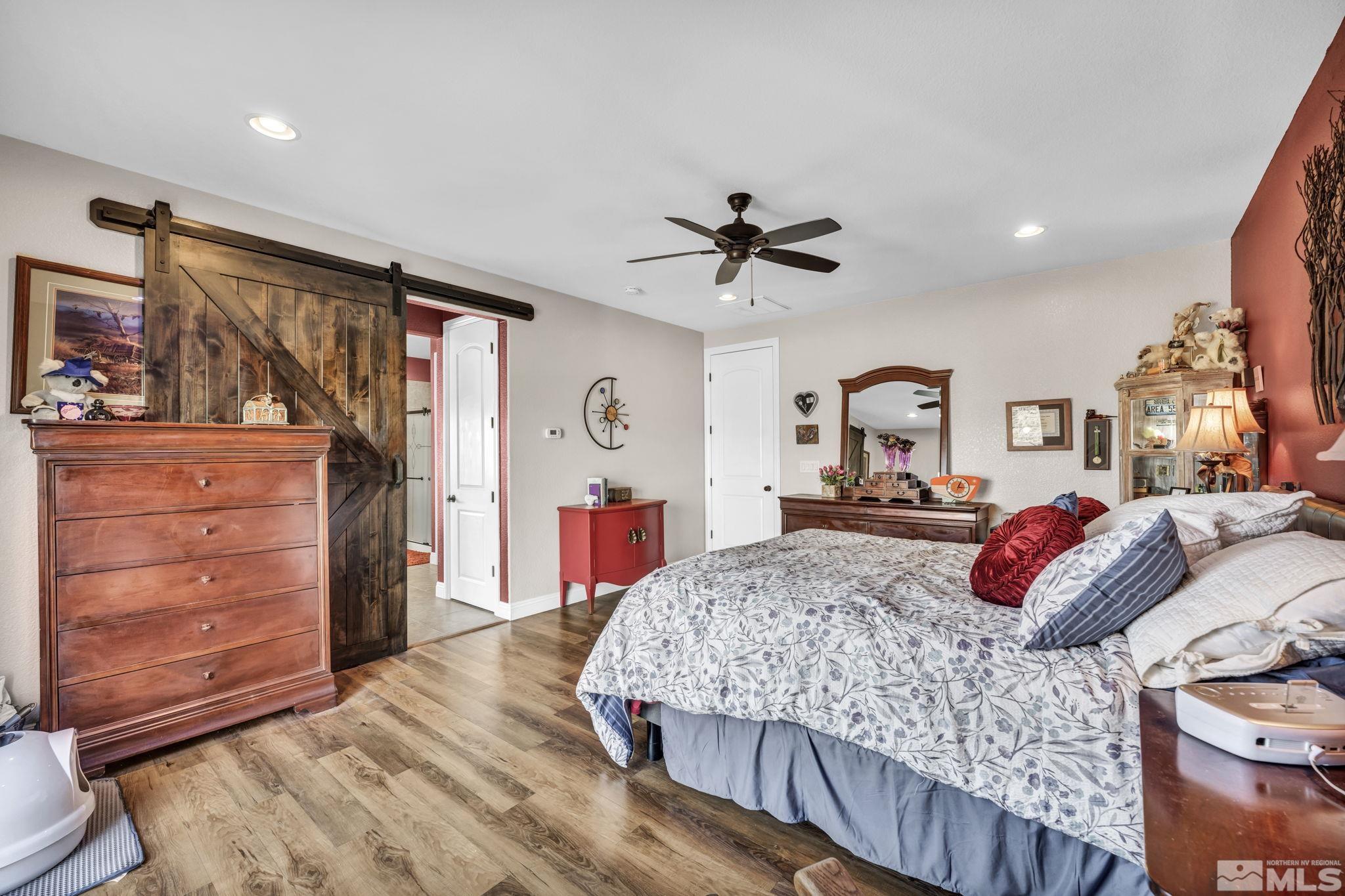 1610 Elk Run Trail Reno, NV 89523 - Photo 17 of 33 a bedroom with a bed a dresser and a mirror