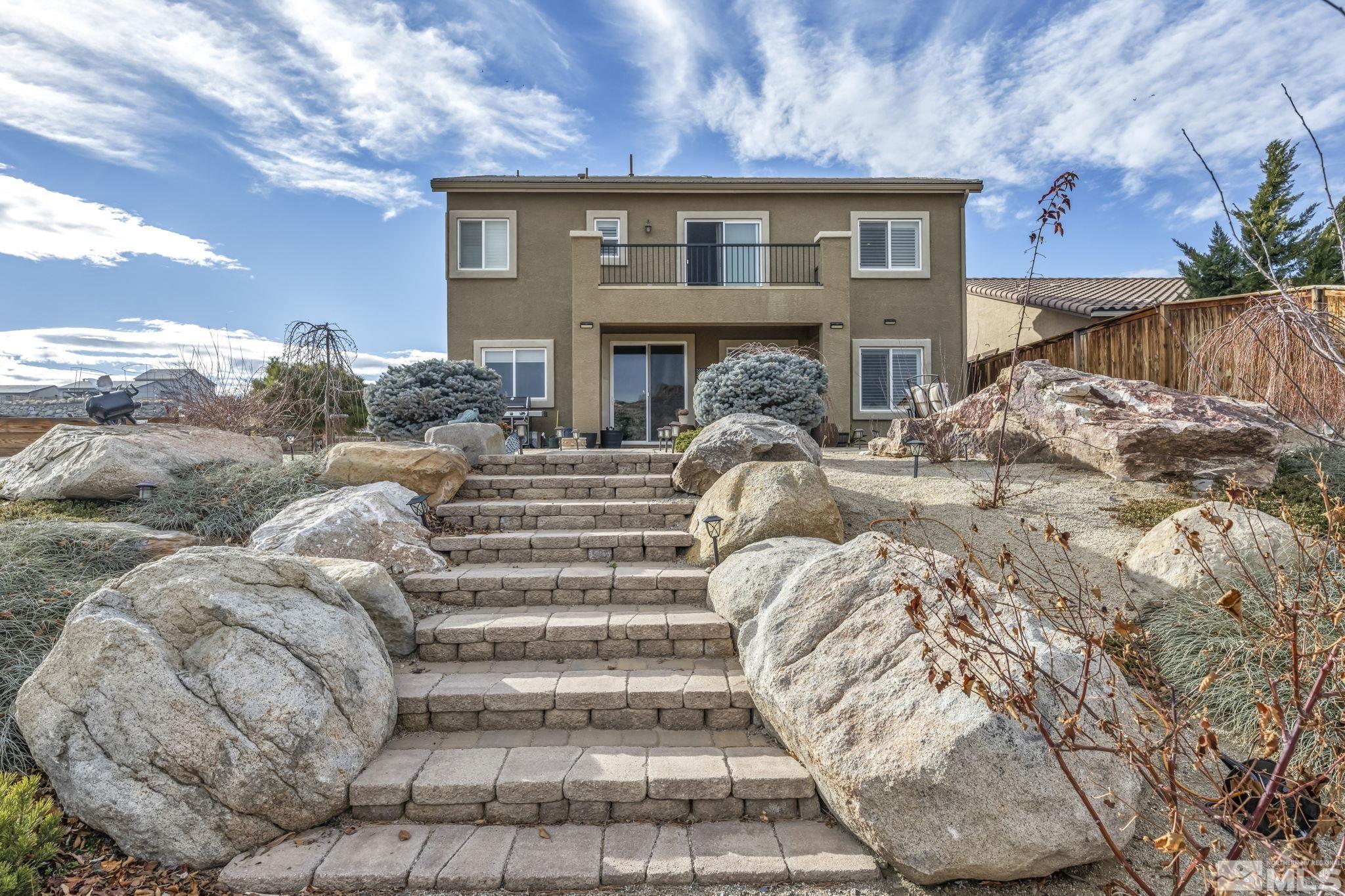 1610 Elk Run Trail Reno, NV 89523 - Photo 31 of 33 a bed room with a bed and a fireplace