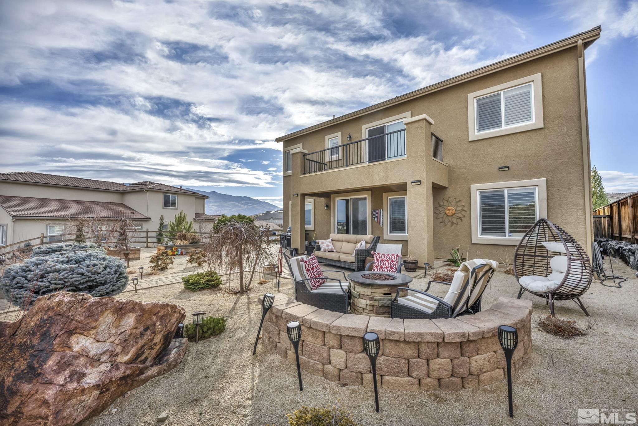 1610 Elk Run Trail Reno, NV 89523 - Photo 33 of 33 a view of a patio with couches table and chairs and potted plants