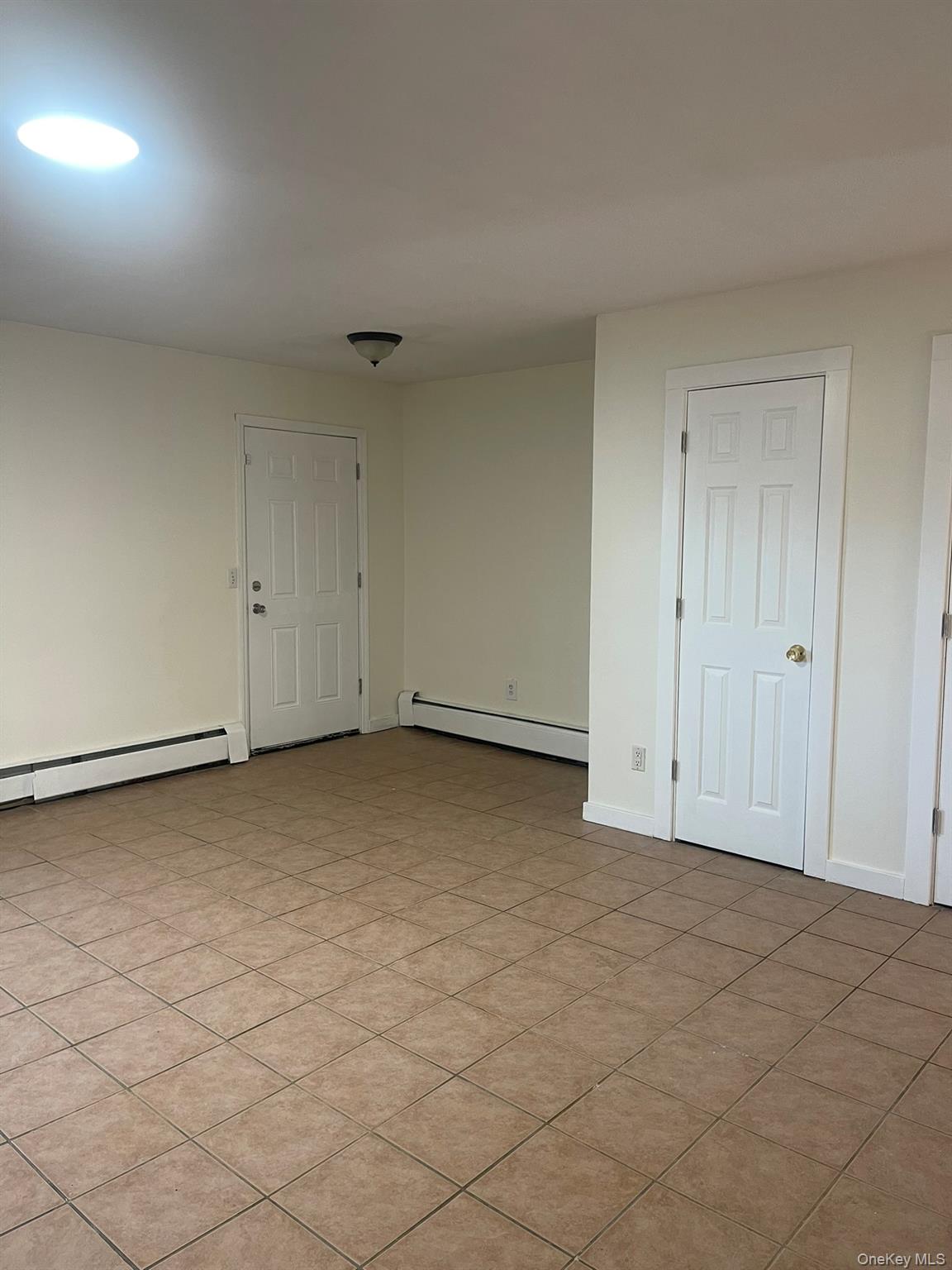 18 Chaucer Court Middletown, NY 10941 - Photo 6 of 8 a view of an empty room and window