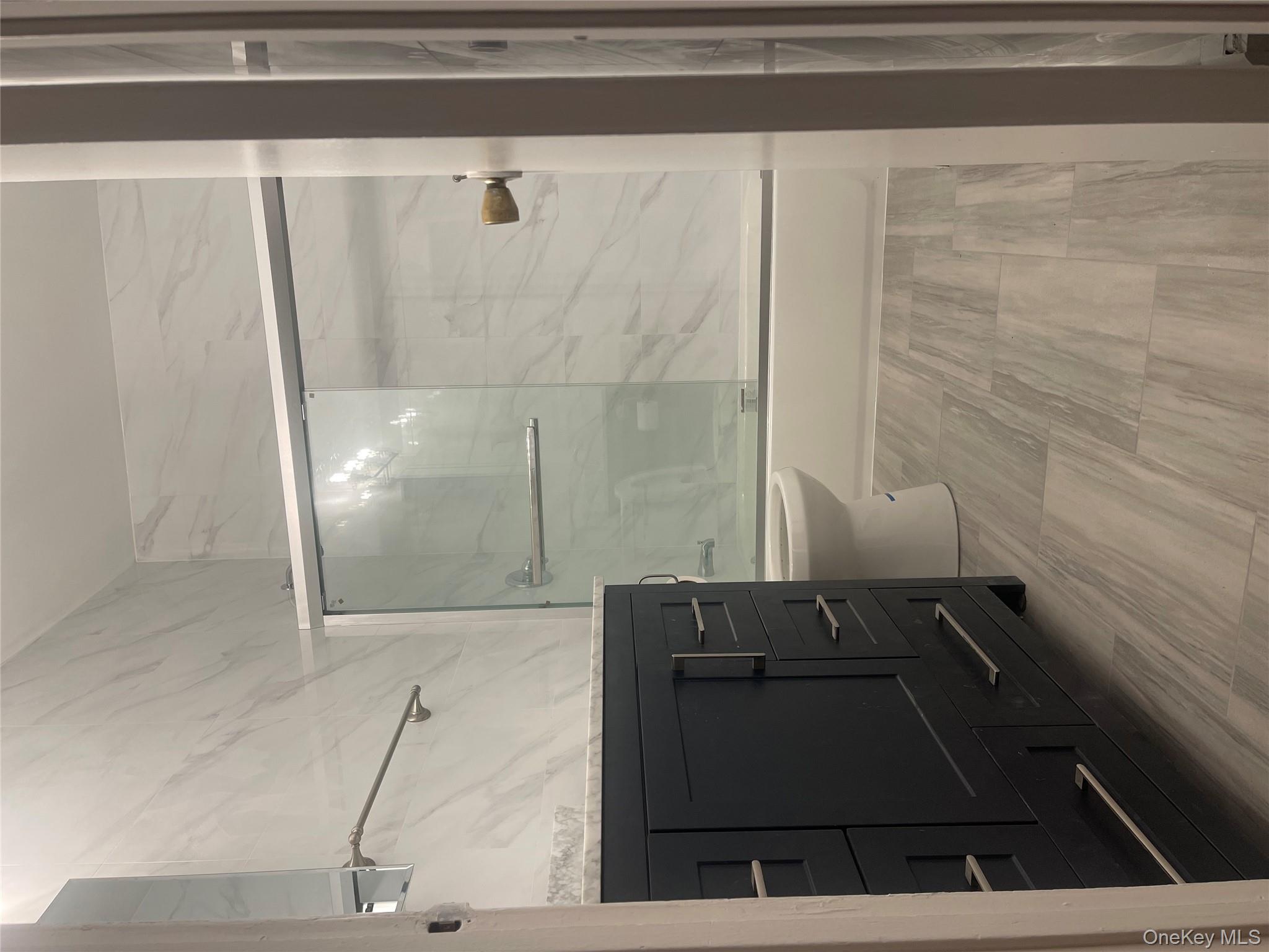 18 Chaucer Court Middletown, NY 10941 - Photo 7 of 8 a bathroom with a bathtub and a shower