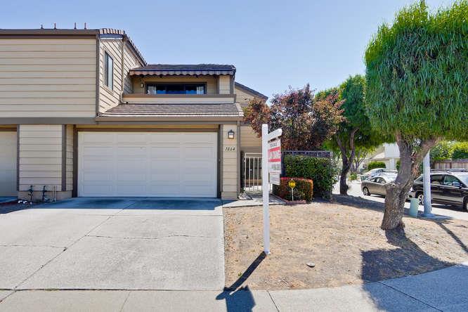 a view of a house with sitting area and furniture