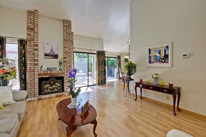 1064 Dempsey Road Milpitas, CA 95035 - Photo 11 of 39 a living room with furniture a fireplace and next to a window