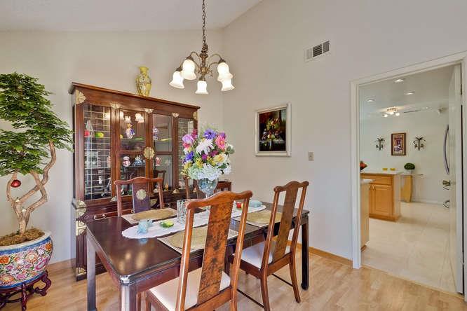 1064 Dempsey Road Milpitas, CA 95035 - Photo 13 of 39 a view of a dining room with furniture and chandelier