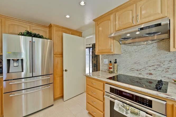 1064 Dempsey Road Milpitas, CA 95035 - Photo 16 of 39 a kitchen with stainless steel appliances a refrigerator sink and cabinets