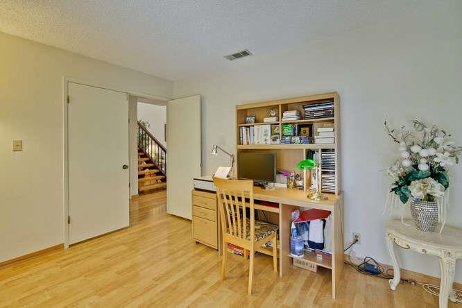 1064 Dempsey Road Milpitas, CA 95035 - Photo 20 of 39 a workspace with furniture wooden floor and a potted plant