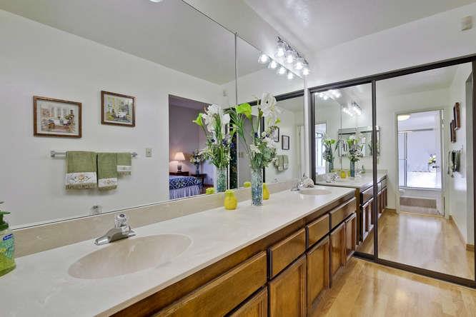 1064 Dempsey Road Milpitas, CA 95035 - Photo 24 of 39 a bathroom with a sink double vanity and a mirror