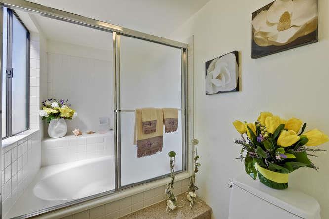 1064 Dempsey Road Milpitas, CA 95035 - Photo 25 of 39 a bathroom with a sink mirror and vanity