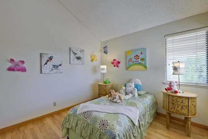 1064 Dempsey Road Milpitas, CA 95035 - Photo 29 of 39 a bedroom with a bed and a window