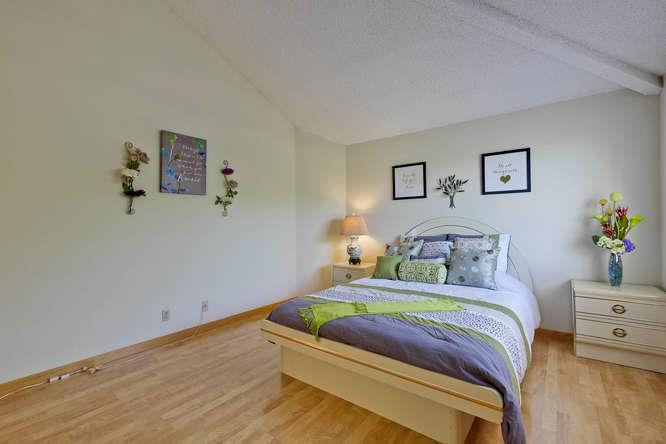 1064 Dempsey Road Milpitas, CA 95035 - Photo 31 of 39 a bedroom with a bed and a dresser