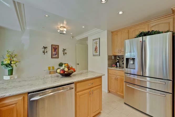 1064 Dempsey Road Milpitas, CA 95035 - Photo 7 of 39 a kitchen with stainless steel appliances a sink and refrigerator